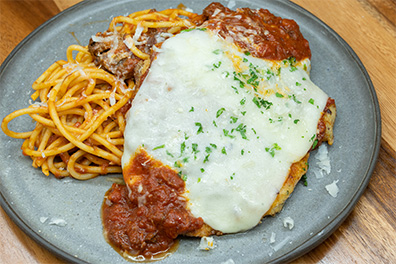 Chicken Parmesan with Spaghetti prepared for the best Italian takeout near Ashland, Cherry Hill, New Jersey.