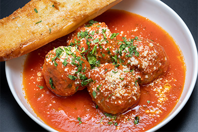 Meatballs in pasta sauce and bread for Barclay-Kingston, Cherry Hill pasta delivery.